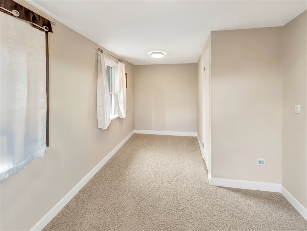 54 Salisbury Street Hull, MA 02045 - Photo 27 of 38 a view of a small space with wooden floor and a window