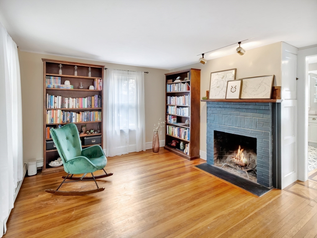 54 Salisbury Street Hull, MA 02045 - Photo 3 of 38 a living room with furniture and a fireplace