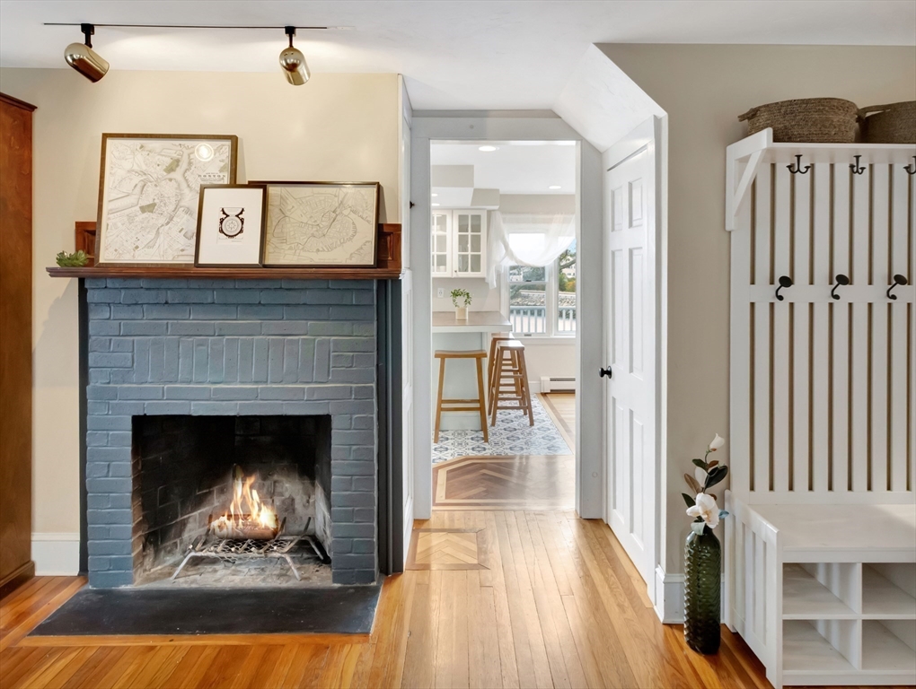 54 Salisbury Street Hull, MA 02045 - Photo 5 of 38 a living room with furniture and a fireplace