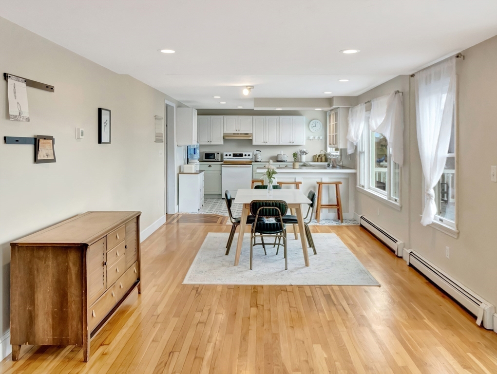 54 Salisbury Street Hull, MA 02045 - Photo 8 of 38 a living room with stainless steel appliances furniture and a table