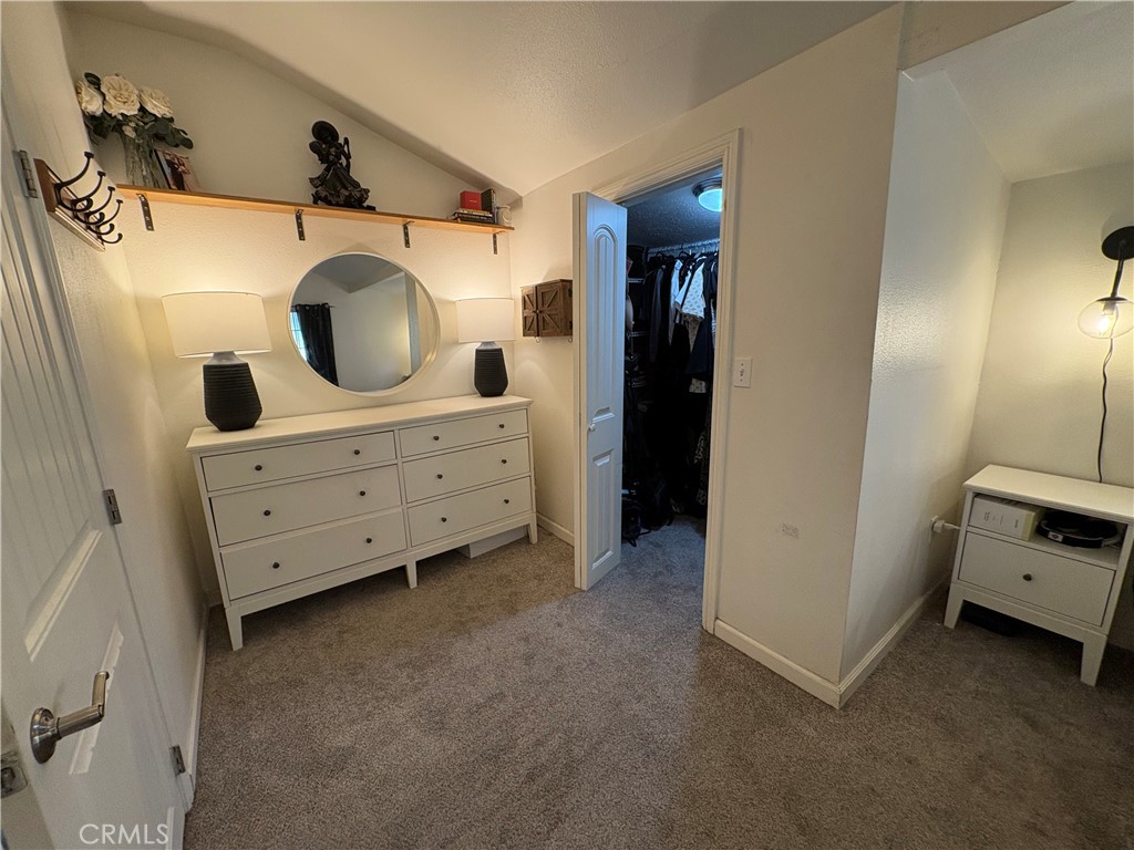 36750 Hilltop Road Yucaipa, CA 92399 - Photo 22 of 27 a view of a hallway with washer and dryer