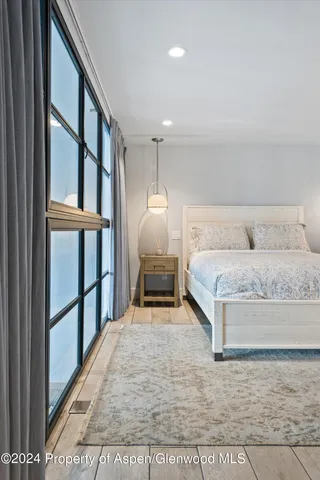 a bedroom with a bed and a walk in closet