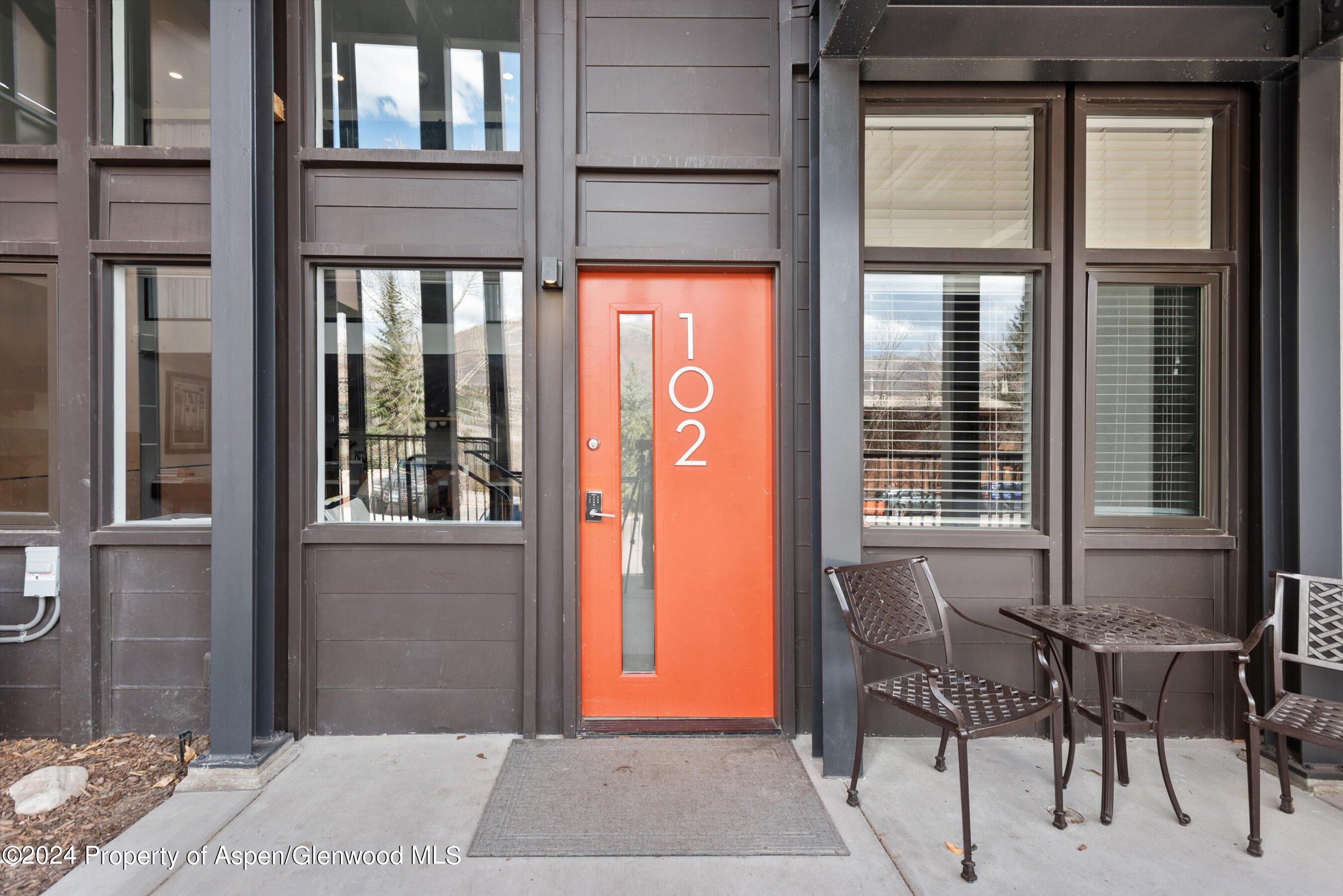 800 South Mill Street, Unit 102C Aspen, CO 81611 - Photo 2 of 23 a front view of a house with outdoor seating