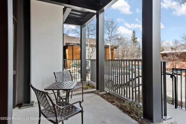 a swimming pool with outdoor seating and yard