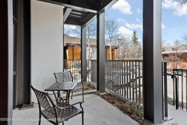 a swimming pool with outdoor seating and yard