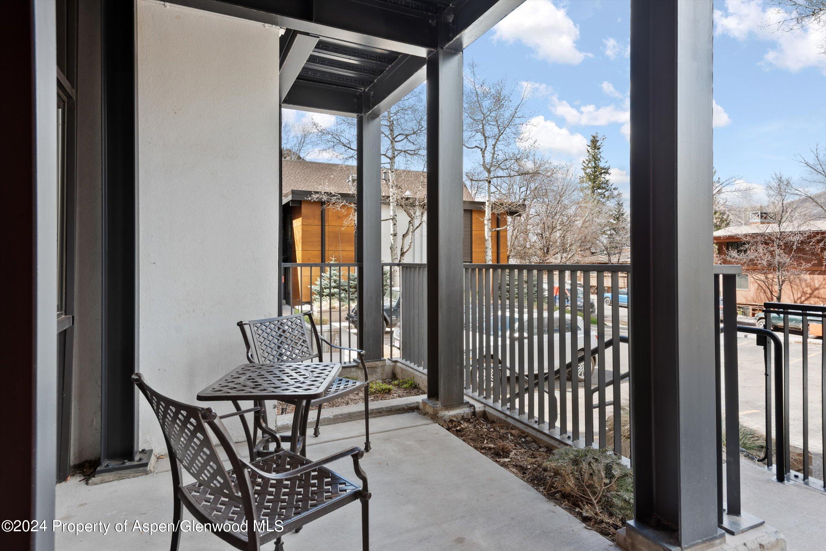 800 South Mill Street, Unit 102C Aspen, CO 81611 - Photo 22 of 23 a view of a balcony with furniture