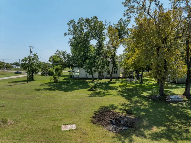 a view of a trees with a yard