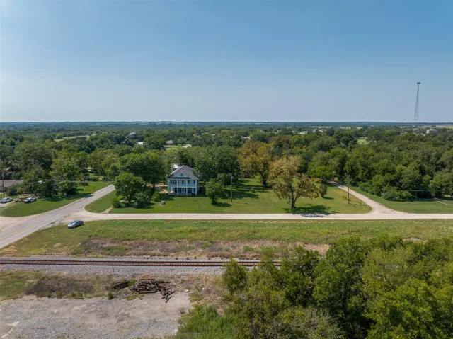 a view of a field with an ocean view