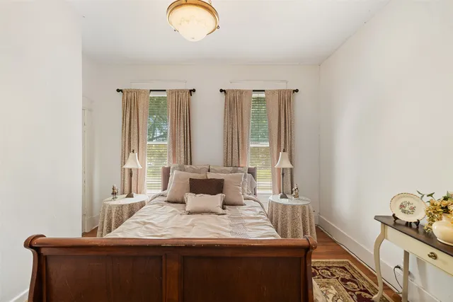 a bedroom with a bed and window