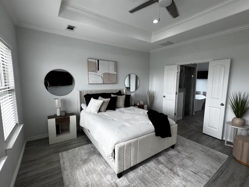 2295 Diamond D Lane Beaumont, TX 77713 - Photo 11 of 40 a bedroom with a large bed and wooden floor