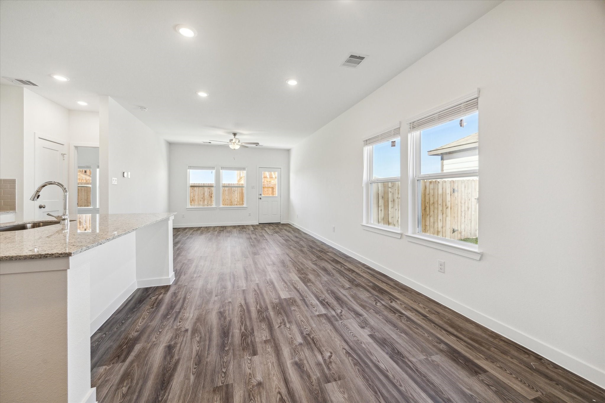 3926 Glory Grn Drive Brookshire, TX 77423 - Photo 9 of 21 a view of an empty room with wooden floor and a window