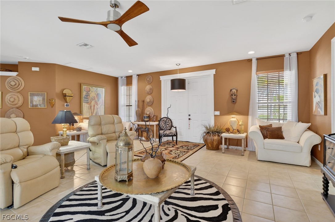 4914 Southwest 25th Court Cape Coral, FL 33914 - Photo 2 of 22 a living room with furniture and a large window