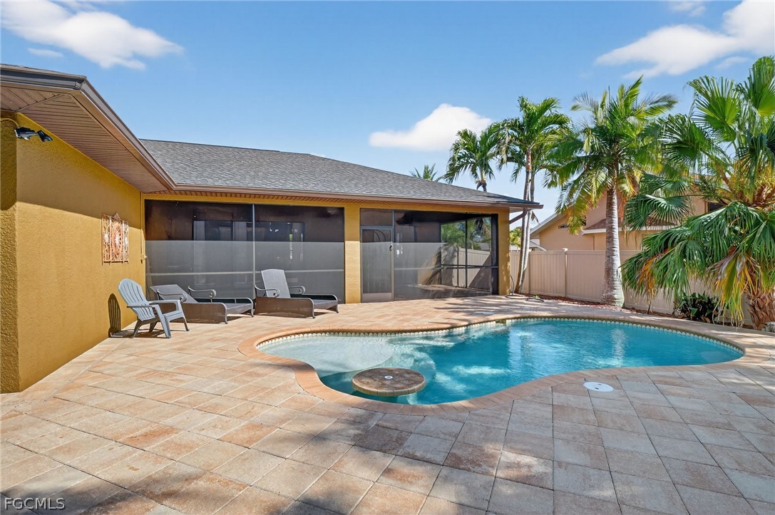 4914 Southwest 25th Court Cape Coral, FL 33914 - Photo 21 of 22 a view of a house with swimming pool and sitting area