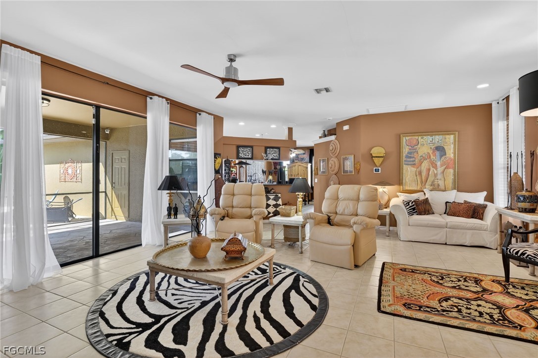 4914 Southwest 25th Court Cape Coral, FL 33914 - Photo 4 of 22 a living room with furniture and a large window