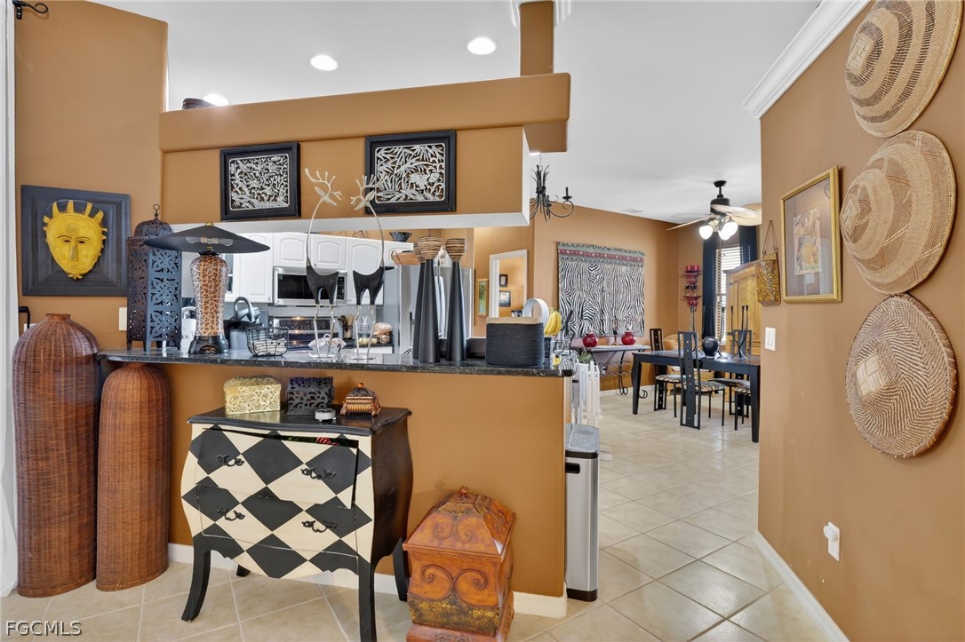4914 Southwest 25th Court Cape Coral, FL 33914 - Photo 5 of 22 a dinning table and chairs in a room