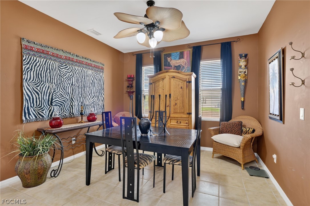 4914 Southwest 25th Court Cape Coral, FL 33914 - Photo 9 of 22 a living room with furniture and a potted plant