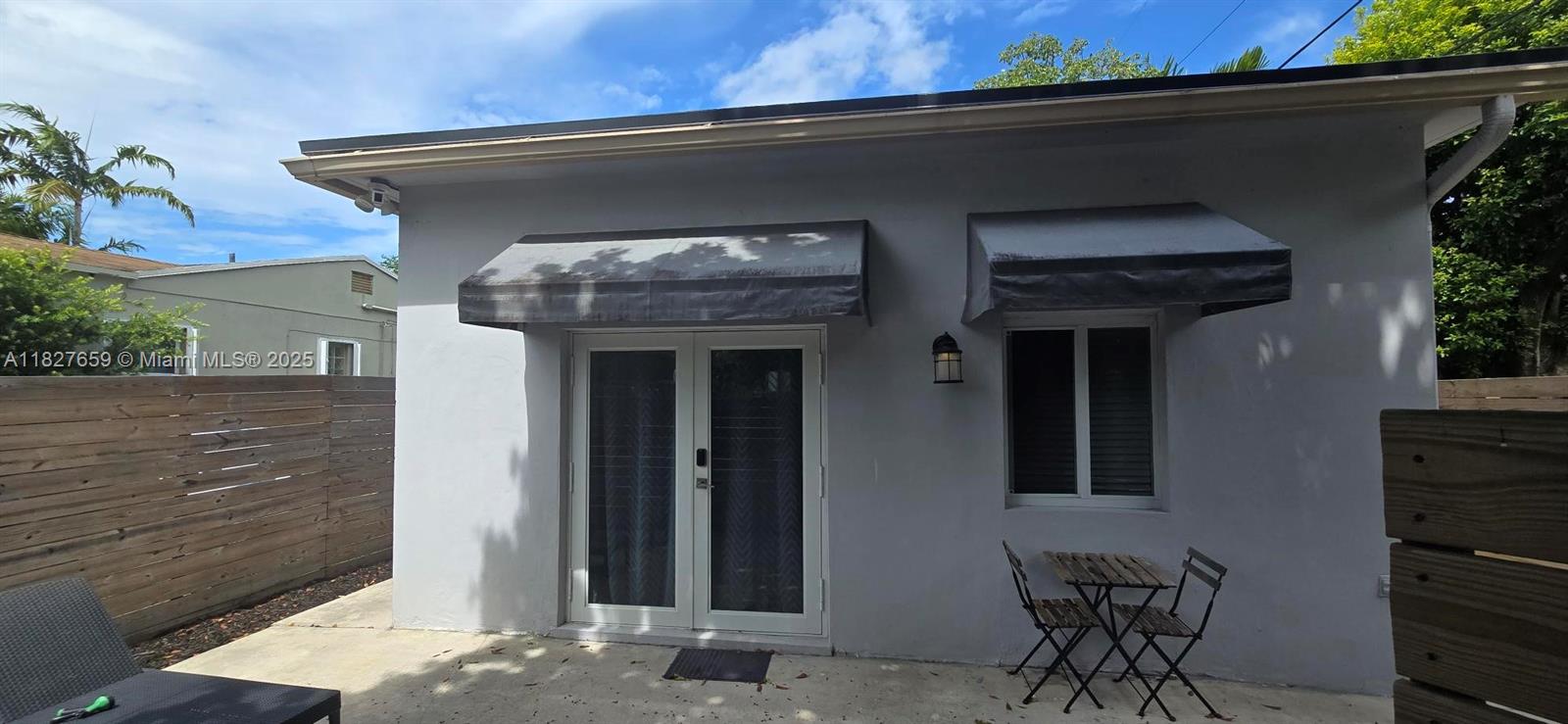 2601 Southwest 24th Avenue, Unit 2 Miami, FL 33133 - Photo 2 of 13 a front view of a house with glass windows