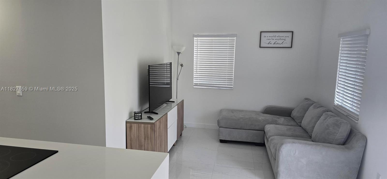 2601 Southwest 24th Avenue, Unit 2 Miami, FL 33133 - Photo 3 of 13 a living room with furniture and a window