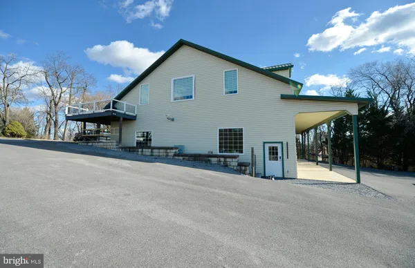 a view of an empty room and a window