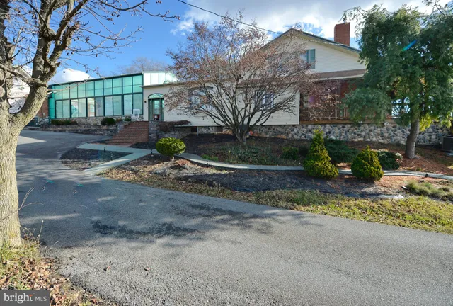 a view of a house with a street