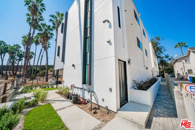 an aerial view of a house with yard