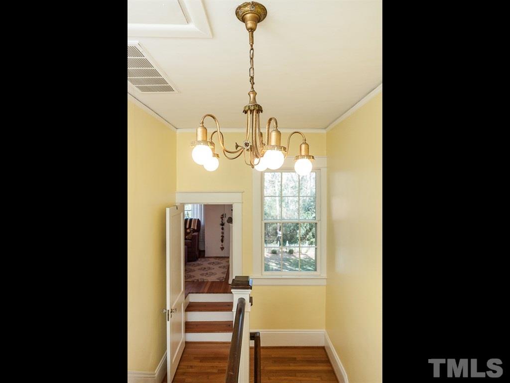 3400 Ruffin Street Raleigh, NC 27607 - Photo 11 of 21 a view of a living room and chandelier