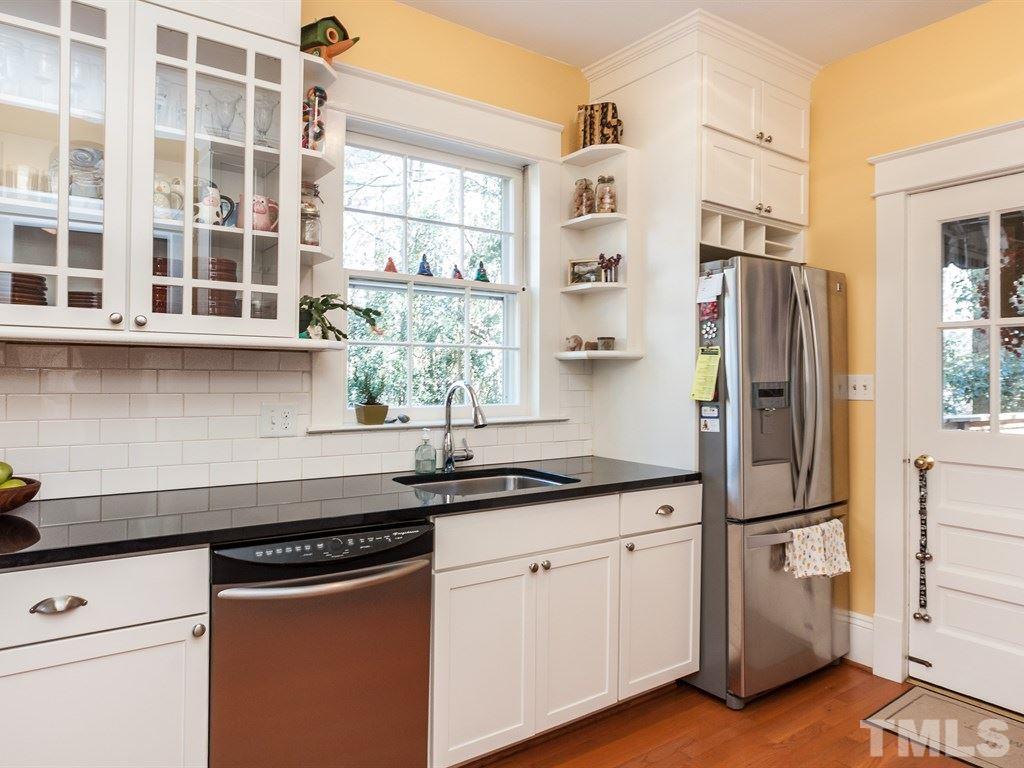 3400 Ruffin Street Raleigh, NC 27607 - Photo 8 of 21 a kitchen with stainless steel appliances granite countertop a sink and a refrigerator