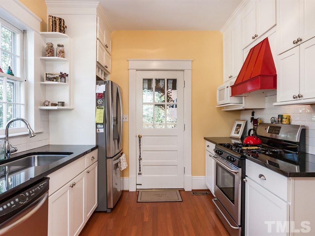 3400 Ruffin Street Raleigh, NC 27607 - Photo 9 of 21 a kitchen with stainless steel appliances granite countertop a stove and a refrigerator