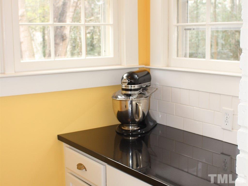 3400 Ruffin Street Raleigh, NC 27607 - Photo 10 of 21 a kitchen with a stove and a window