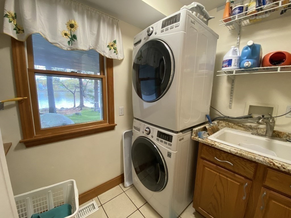 10 Cedar Lane Tyngsborough, MA 01879 - Photo 19 of 42 a utility room with sink dryer and washer