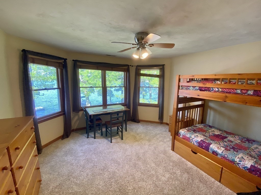 10 Cedar Lane Tyngsborough, MA 01879 - Photo 24 of 42 a bed room with a bed and a chair