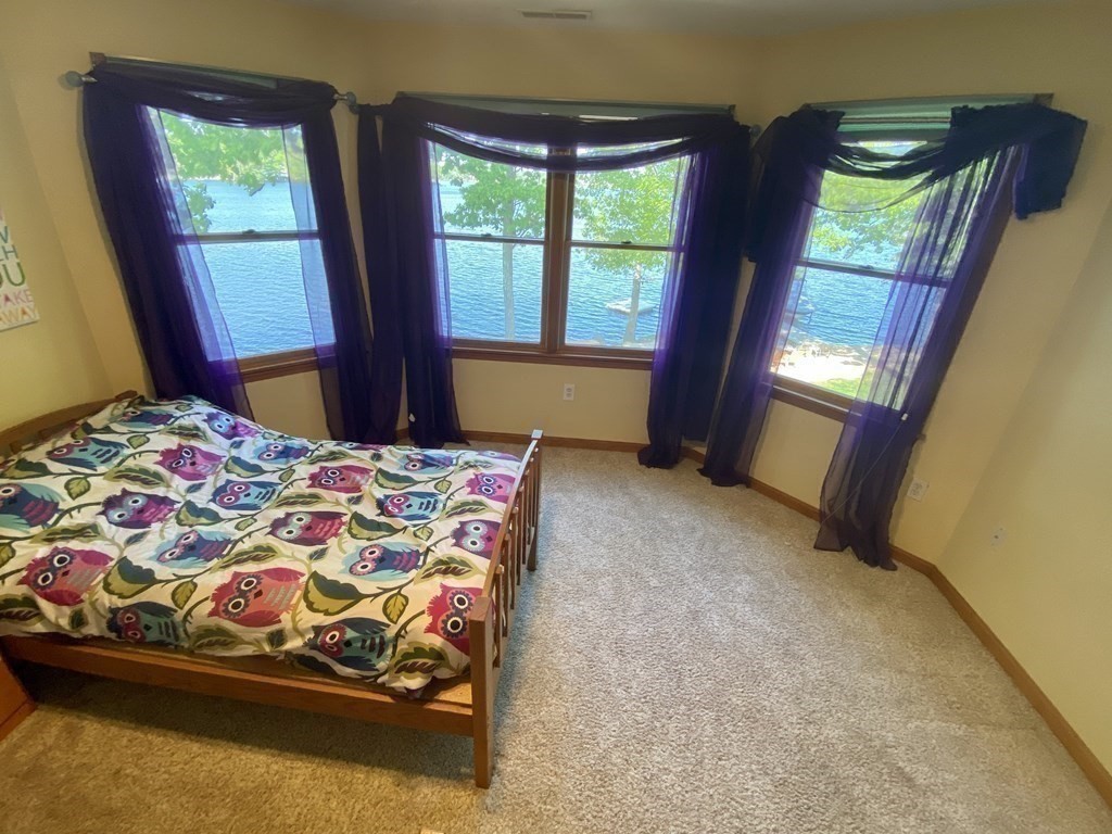 10 Cedar Lane Tyngsborough, MA 01879 - Photo 29 of 42 a bedroom with a bed and window