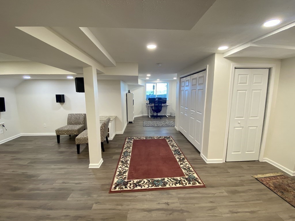 10 Cedar Lane Tyngsborough, MA 01879 - Photo 34 of 42 a living room with furniture and a rug