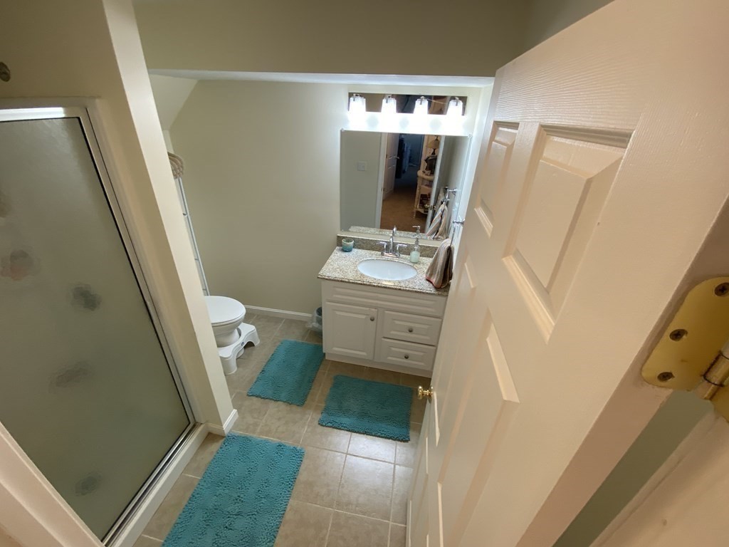 10 Cedar Lane Tyngsborough, MA 01879 - Photo 36 of 42 a bathroom with a sink and mirror