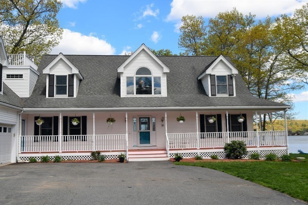10 Cedar Lane Tyngsborough, MA 01879 - Photo 40 of 42 a front view of a house with a yard