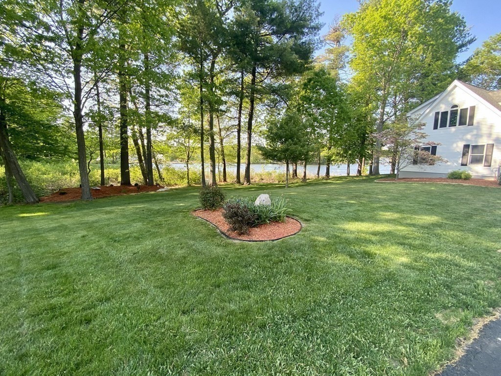 10 Cedar Lane Tyngsborough, MA 01879 - Photo 42 of 42 a view of a house with a backyard