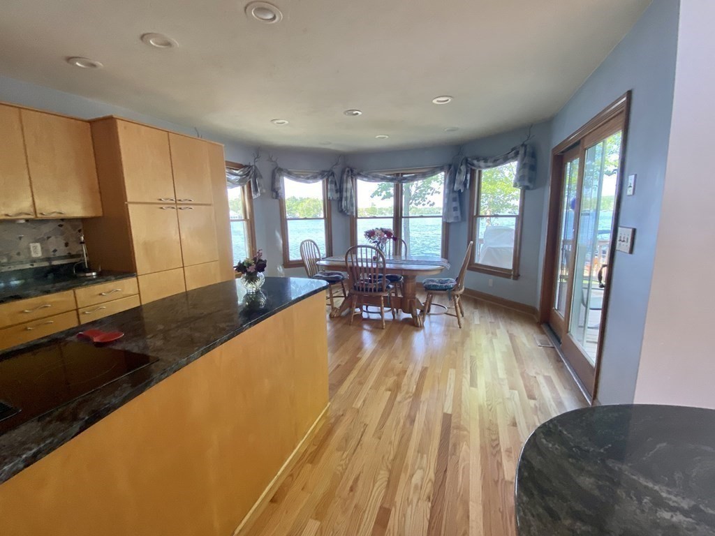 10 Cedar Lane Tyngsborough, MA 01879 - Photo 7 of 42 a living room with furniture pool table wooden floor and a large window