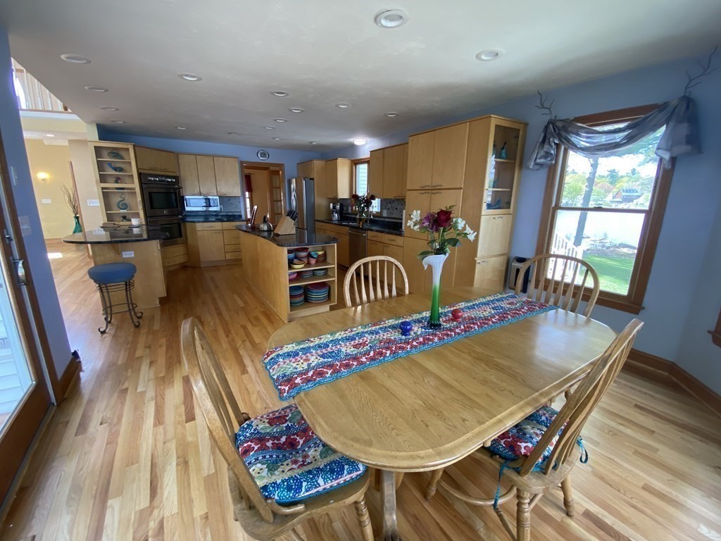 10 Cedar Lane Tyngsborough, MA 01879 - Photo 8 of 42 a living room with dining room and wooden floor