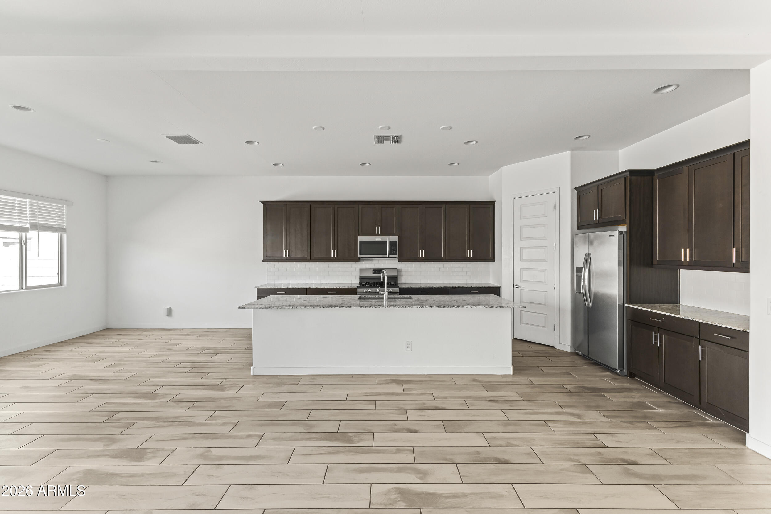 9342 West Roma Avenue Phoenix, AZ 85037 - Photo 14 of 34 Living Room/ Kitchen