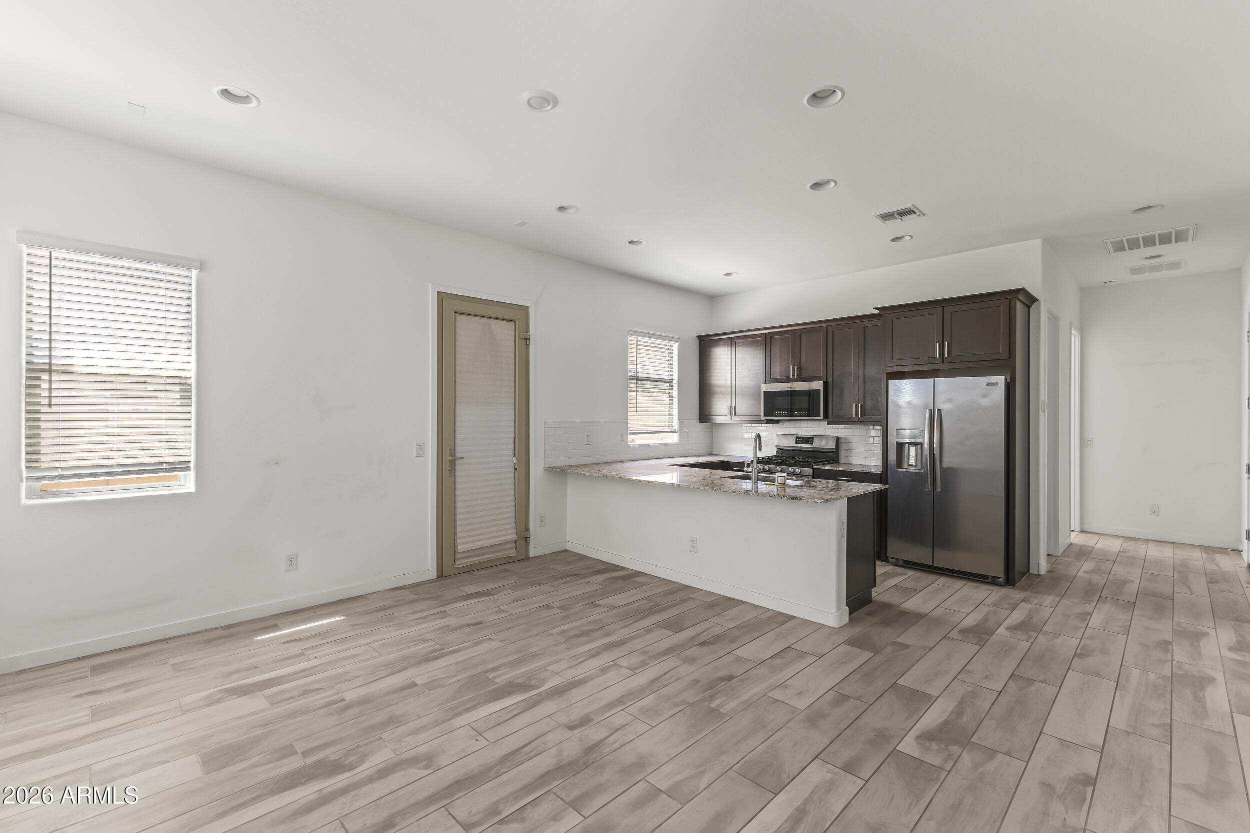 9342 West Roma Avenue Phoenix, AZ 85037 - Photo 31 of 34 Next Gen Kitchen/Living Room
