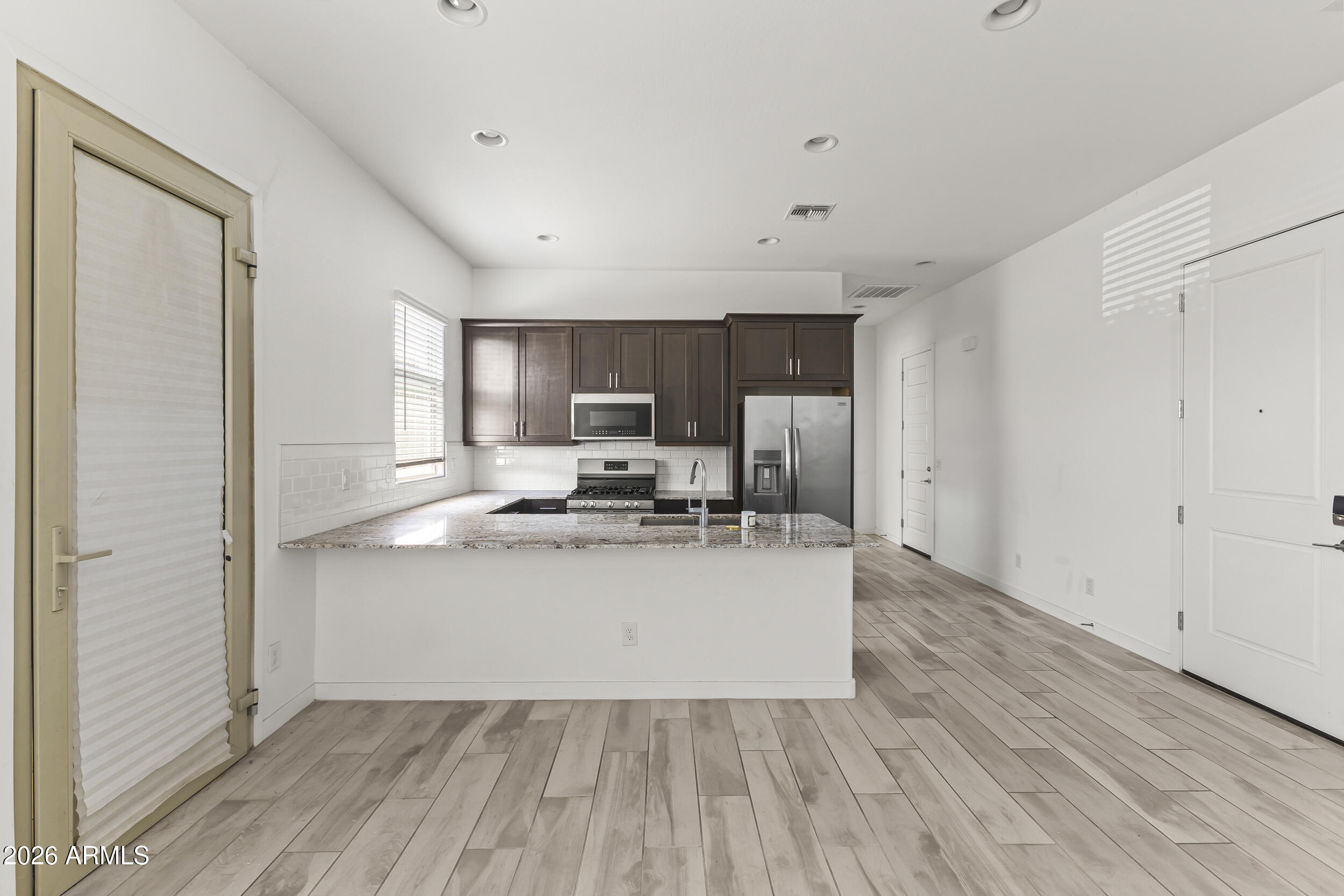 9342 West Roma Avenue Phoenix, AZ 85037 - Photo 32 of 34 Next Gen Kitchen/Living Room