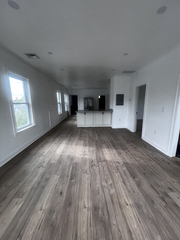 19 Reeves Street Worcester, MA 01607 - Photo 12 of 30 wooden floor in an empty room with a window