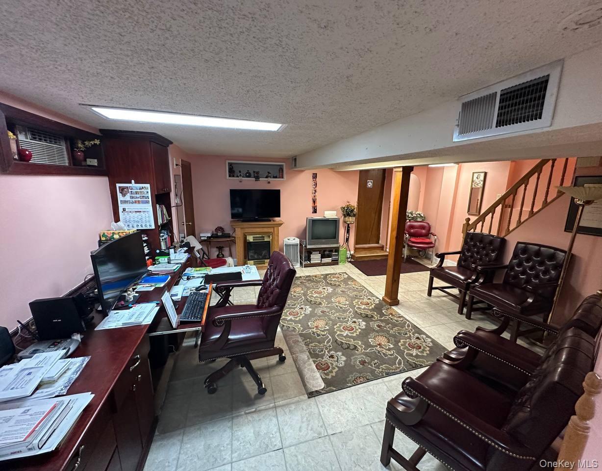 191-53 115th Road Queens, NY 11412 - Photo 11 of 16 a living room with furniture