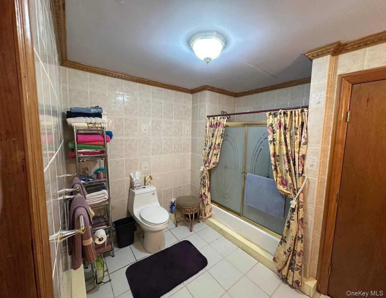 191-53 115th Road Queens, NY 11412 - Photo 13 of 16 a bathroom with a toilet and a shower