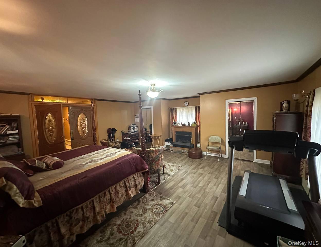 191-53 115th Road Queens, NY 11412 - Photo 6 of 16 a bed room with two beds and a television