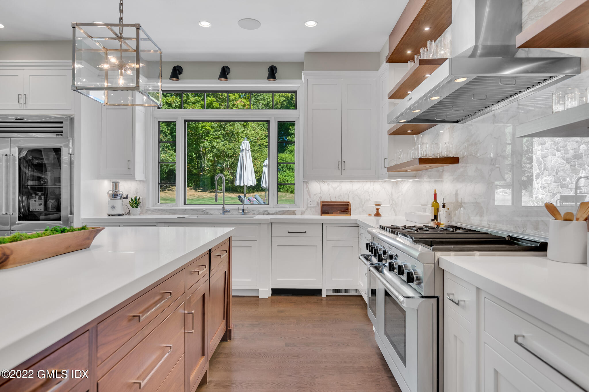 269 Riversville Road Greenwich, CT 06831 - Photo 11 of 55 a kitchen with stainless steel appliances granite countertop a sink stove and cabinets