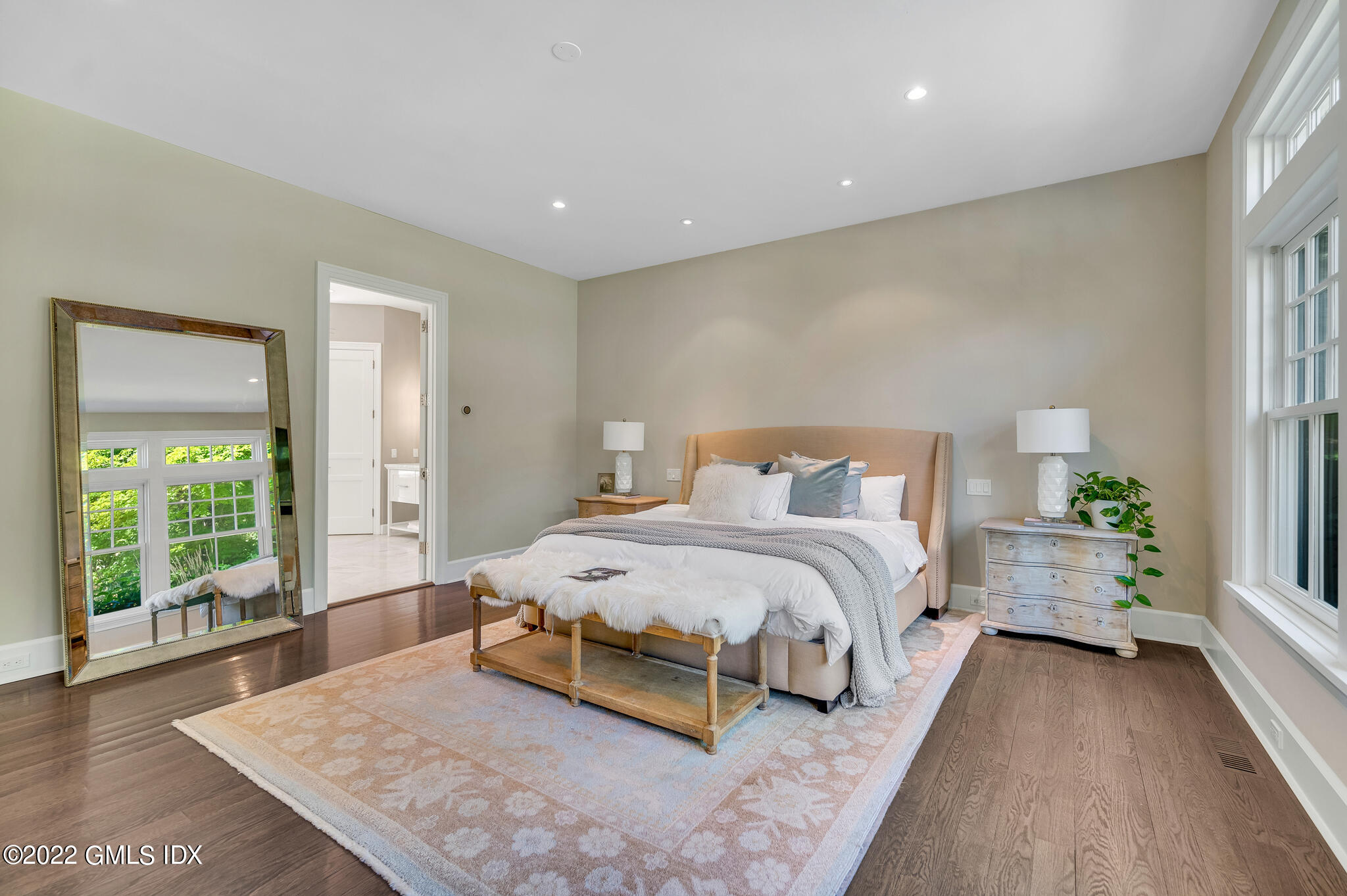 269 Riversville Road Greenwich, CT 06831 - Photo 17 of 55 a spacious bedroom with a bed and a large window