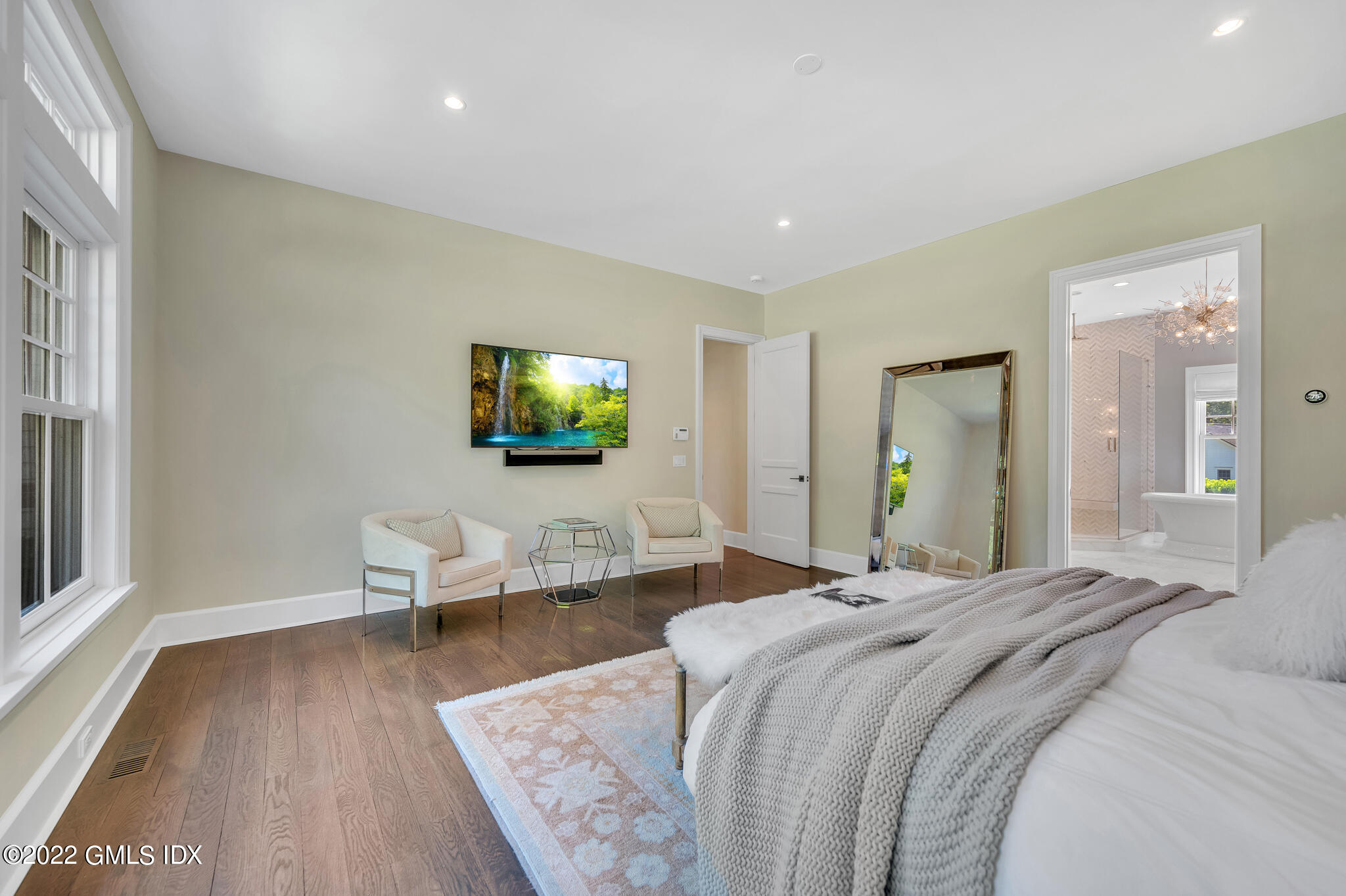 269 Riversville Road Greenwich, CT 06831 - Photo 18 of 55 a bedroom with a bed and large windows