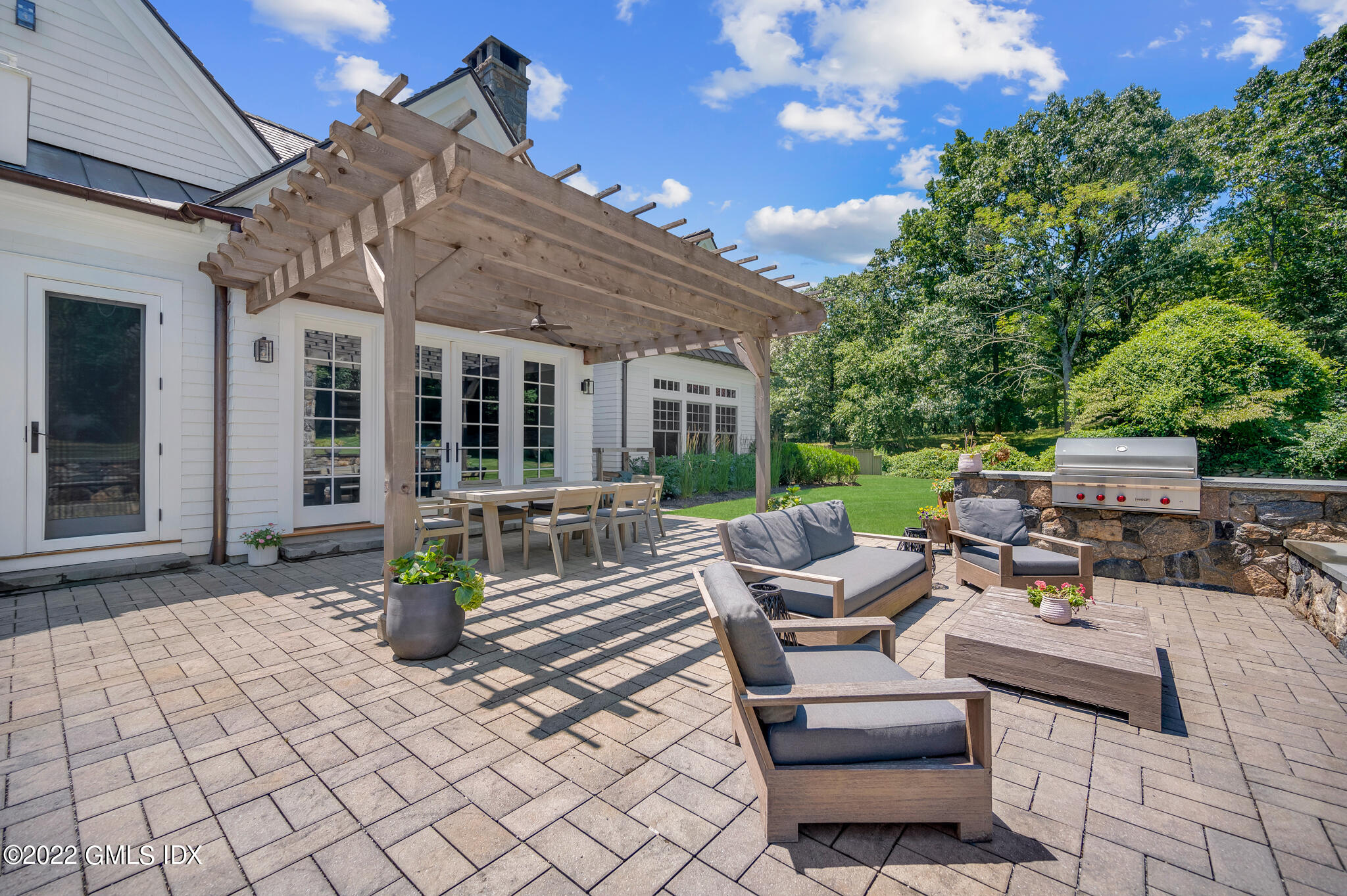 269 Riversville Road Greenwich, CT 06831 - Photo 35 of 55 a view of a patio with chairs and tables
