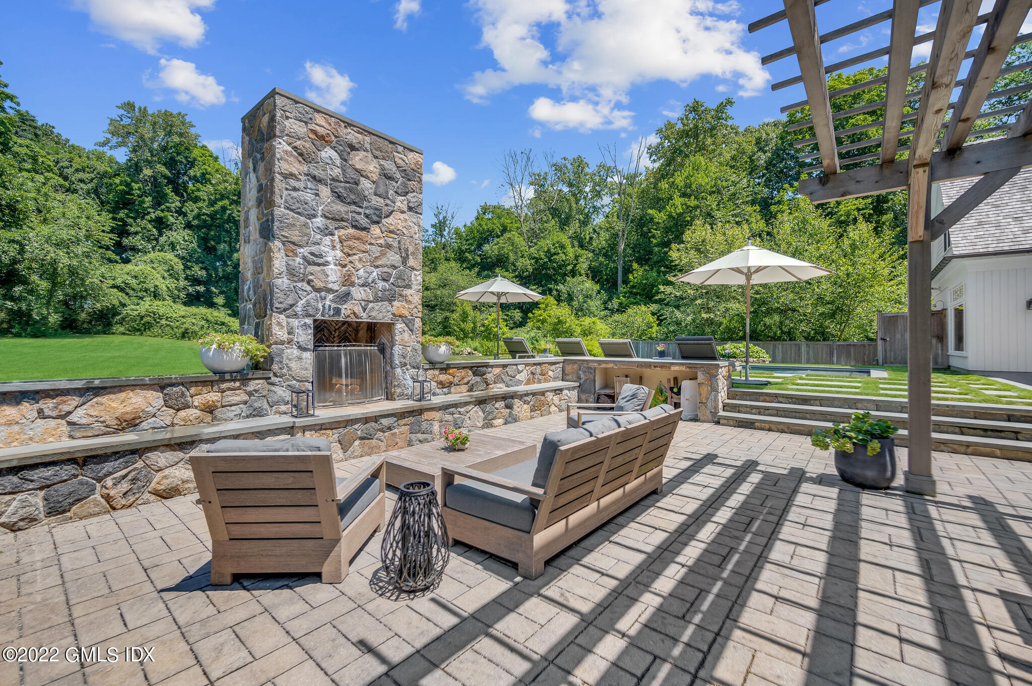 269 Riversville Road Greenwich, CT 06831 - Photo 37 of 55 a view of a terrace with chairs